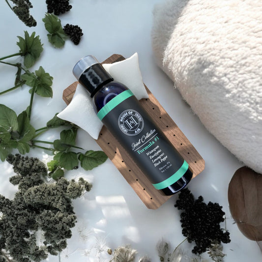 A bottle of House of Aja’s Formula #1 Wintergreen Joint Massage Oil.