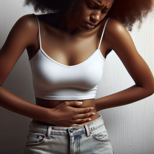 Relieve PMS discomfort naturally with House of Aja – African American woman holding her stomach, showcasing our handmade body butter and essential oils for soothing relief.
