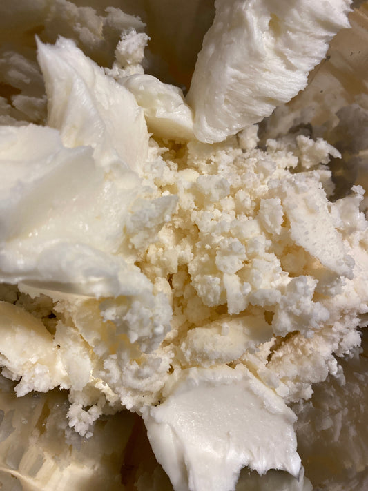 An image of natural ingredients like shea butter, cocoa butter, and essential oils.