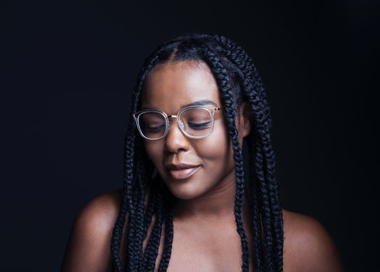 African American woman with braids with black background