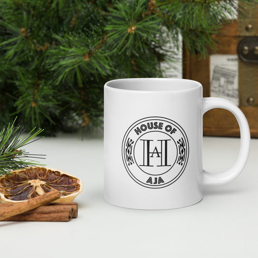 Aromatherapy brand logo on coffee mug sitting on a table with a pine tree in the background of photo